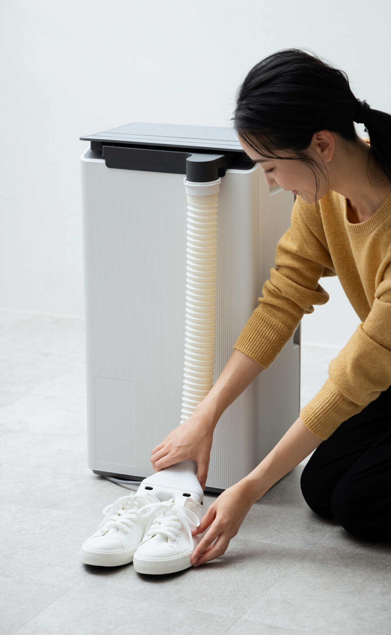 Attaching dehumidifier hose to shoes